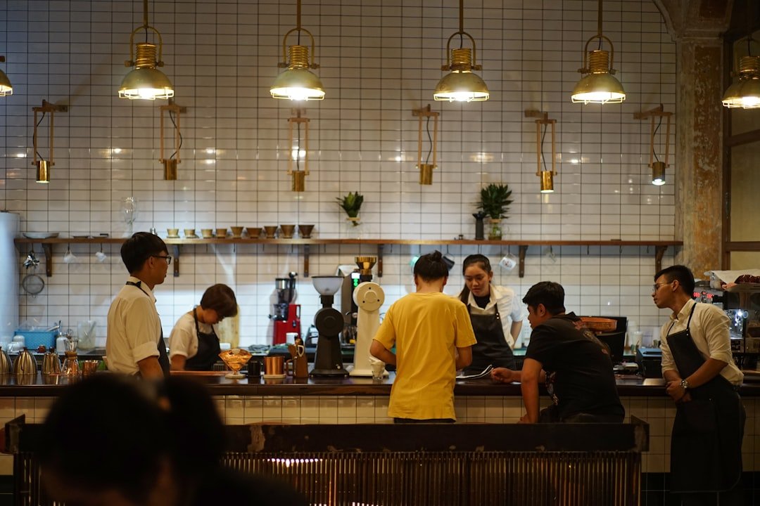 Baristas at coffee counter. Specialty coffee scene in Saigon.